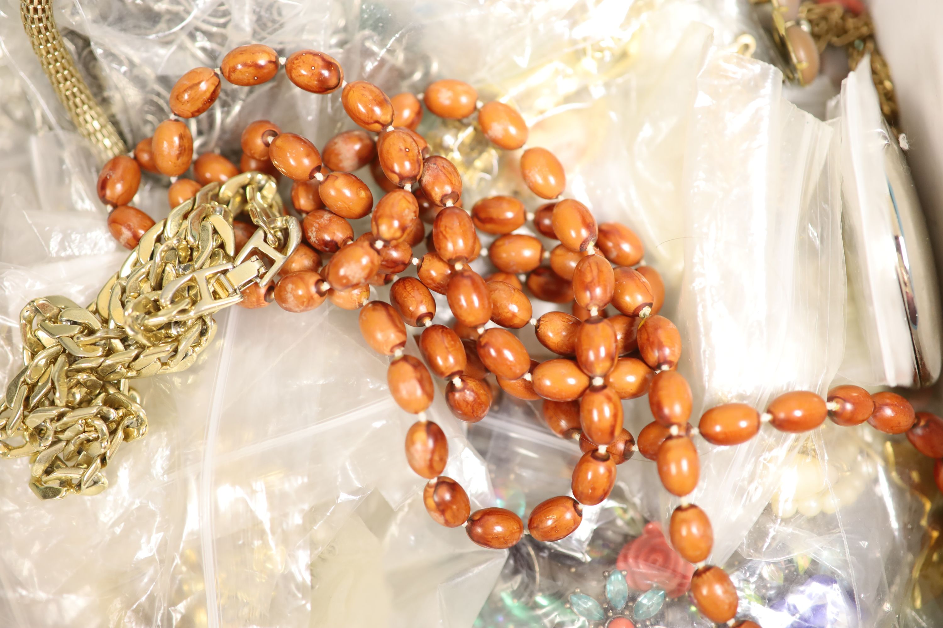 A box of assorted costume jewellery.